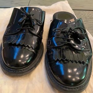 Theory leather black slides.